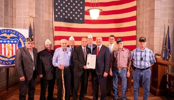Gov. Ricketts (front row, solid red tie), NDVA Director John Hilgert  (back right), and veterans at today’s proclamation signing ceremony.