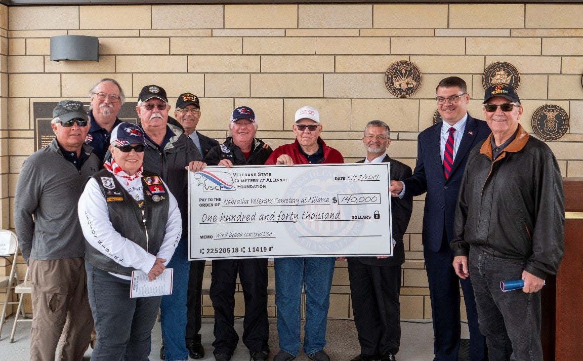 Members of the Veterans State Cemetery at Alliance Foundation present NDVA Director John Hilgert and Cemetery Administrator Allen Pannell with a check for $140,000 to begin construction of a windbreak.