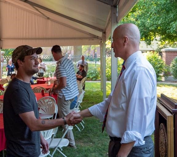 Gov. Ricketts greets a veteran at Thursday’s Welcome Home Picnic.