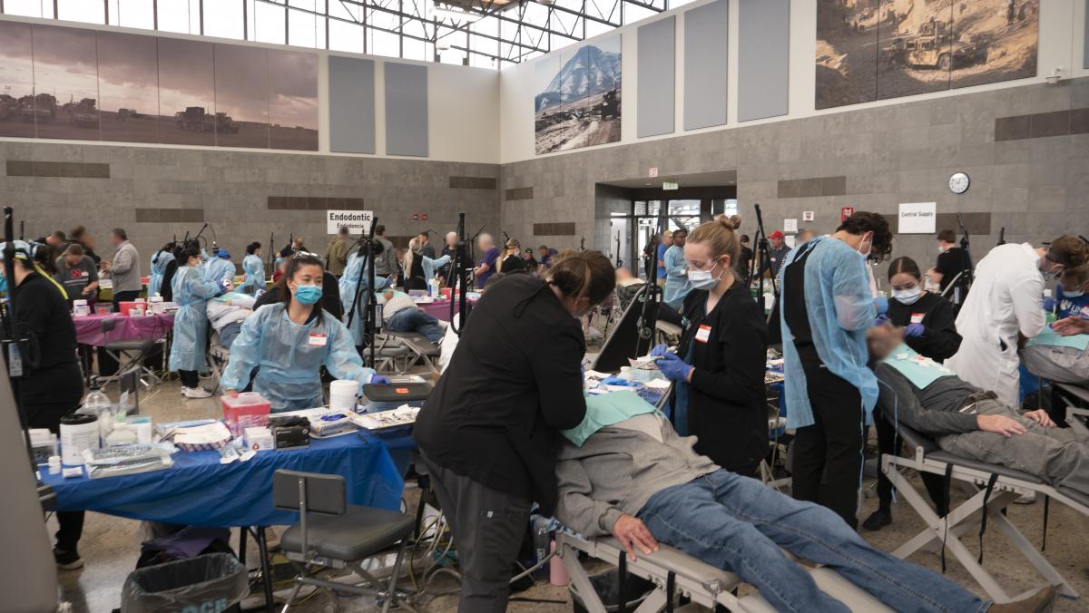 Dentists, dental students, dental hygienists, and dental hygiene students provide care to veterans and their spouses at the Veterans Mission of Mercy Dental Clinic.